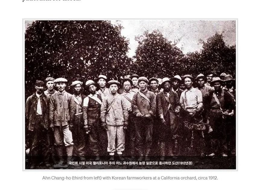 A sepia print of the orchard photograph with a Korean caption inside the frame and an English caption beneath